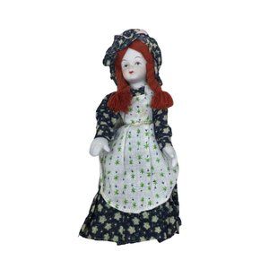 Vintage Porcelain Collectible Doll Wearing Floral Printed Dress With Red Braided